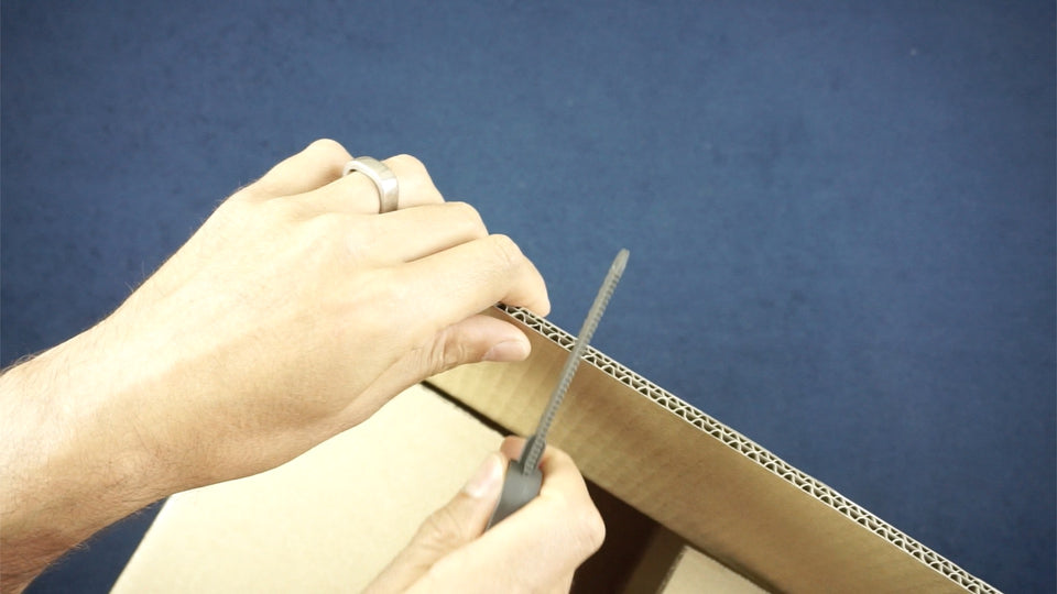 Safely cut cardboard with Makedo cardboard construction safe-saw