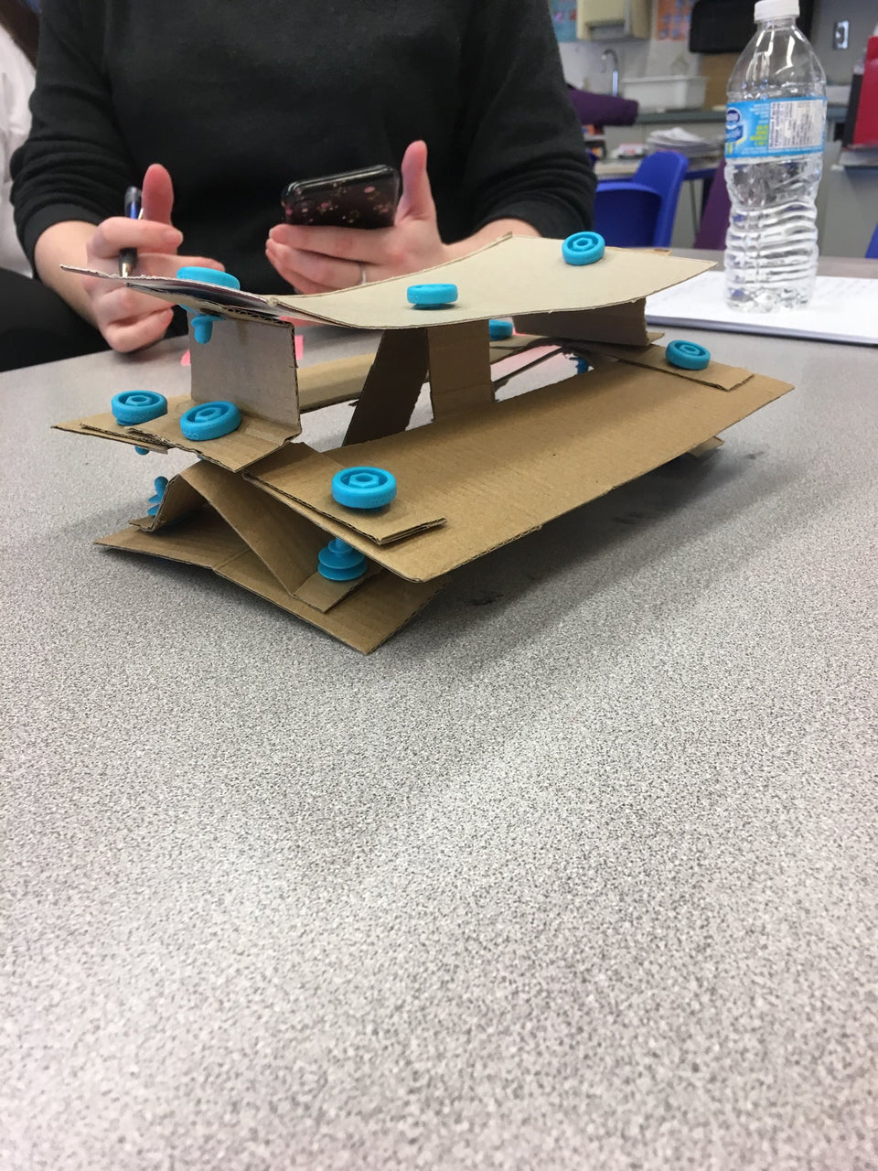 Makedo cardboard construction teacher training making a cardboard bench model.