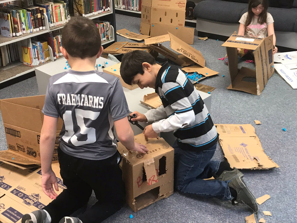 Building shelters - construction in progress with Makedo cardboard tools
