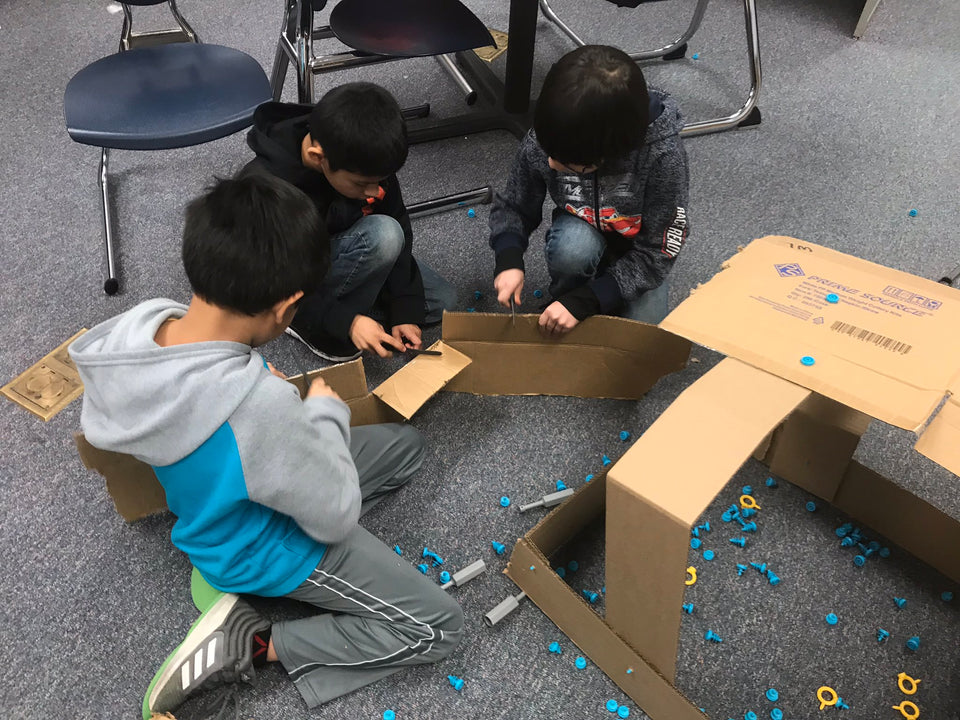 Making cardboard shelters with Makedo cardboard tools