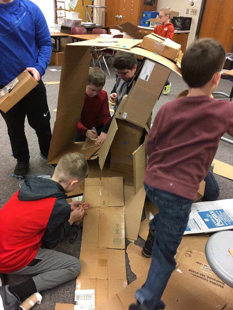 Building the tallest cardboard tower with Makedo tools.